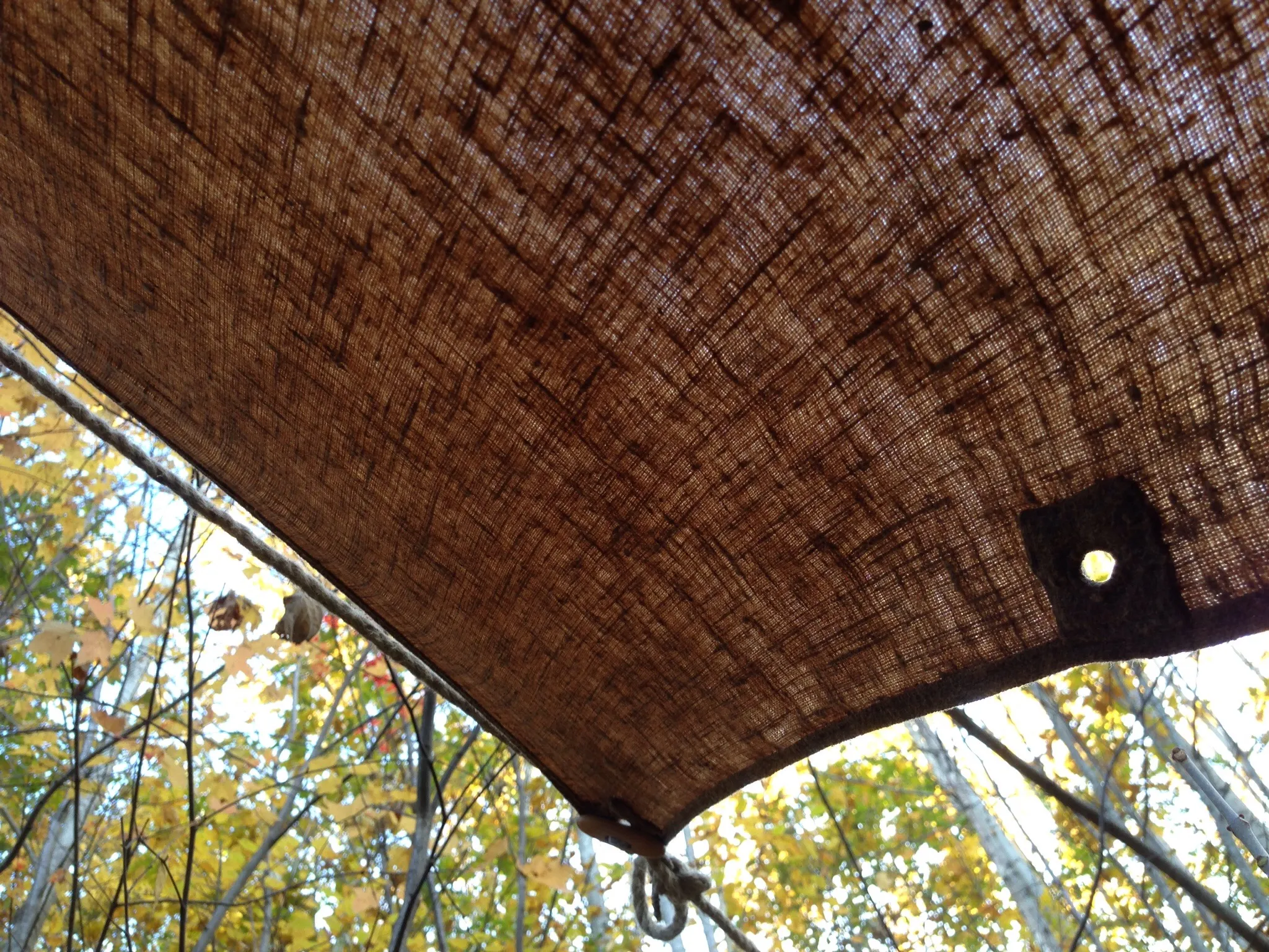 An oiled linen tarp pitched as a shelter